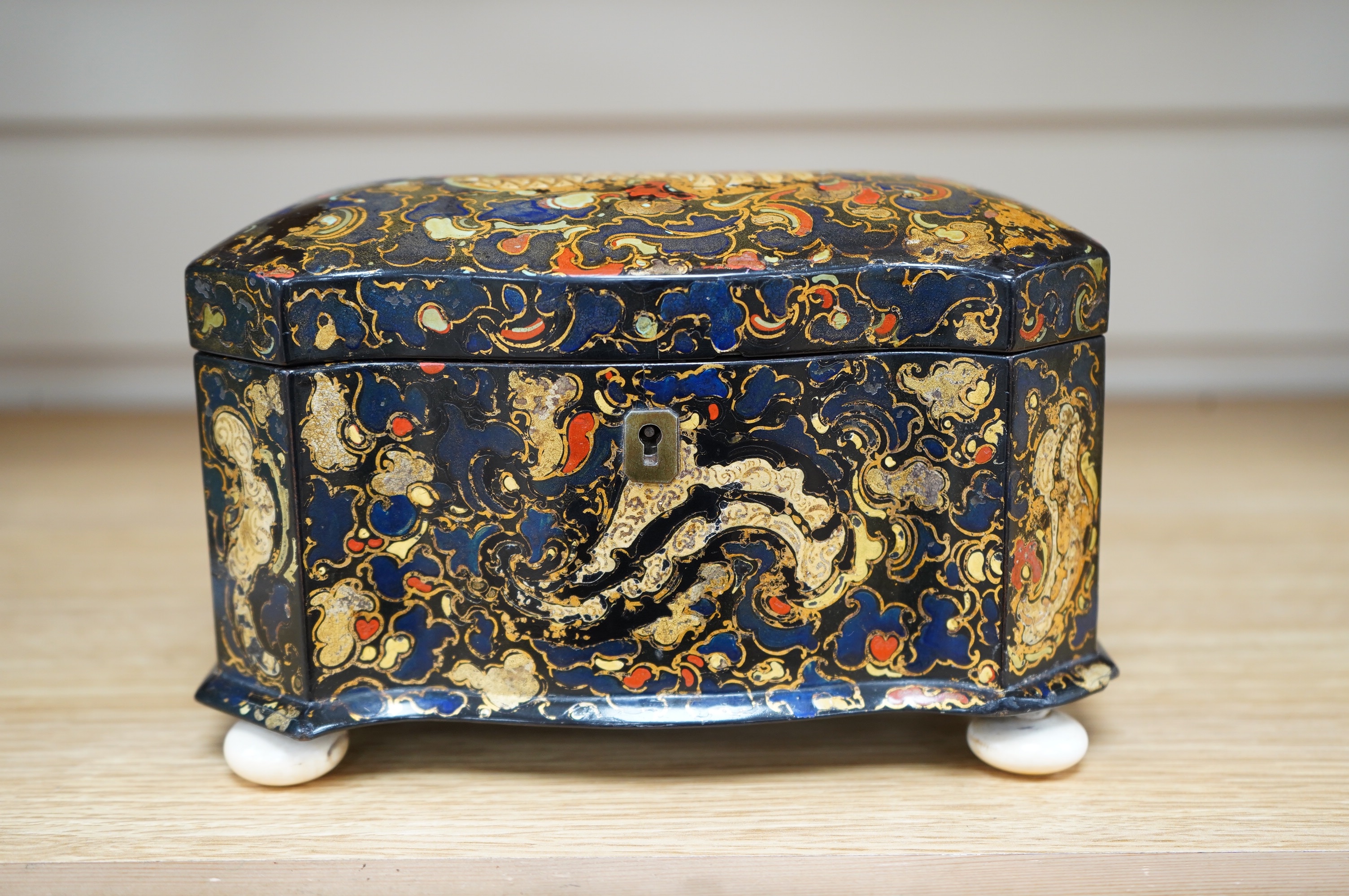 A Victorian Jennens & Bettridge papier mache tea caddy, stamped mark, 20cm wide. CITES Submission reference MB3GJPPY. Condition - fair to good (repaired hinge area)